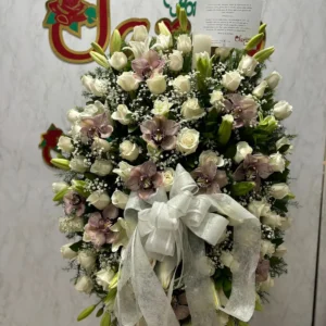 Corona funebre en rosas y orquideas