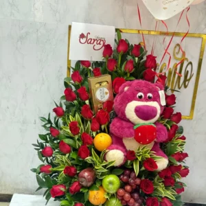 Arreglo floral con frutas, chocolates Ferrero Rocher y globos con helio