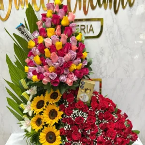 Arreglo floral en rosas surtidas, con girasoles, orquideas, chocolatina Hershey's y chocolates Ferrero Rocher